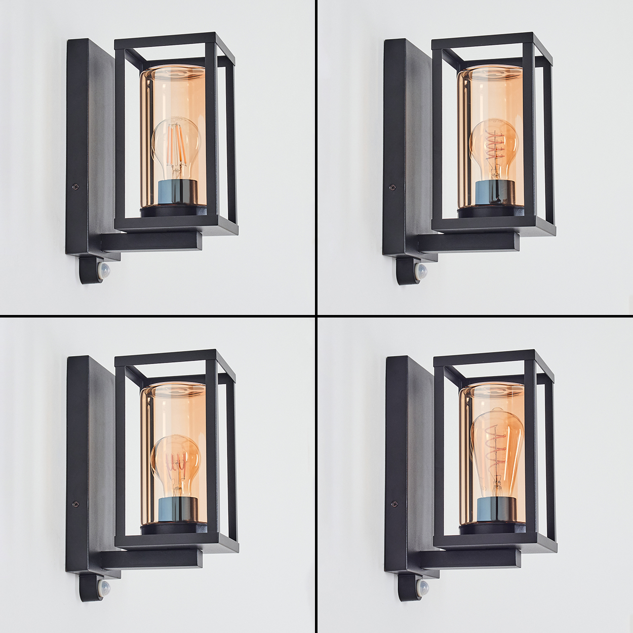 Vier identische Wandlampen, jede mit schwarzem Rahmen, Glasschirm und Edison-Glühbirne, an einer weißen Wand montiert.