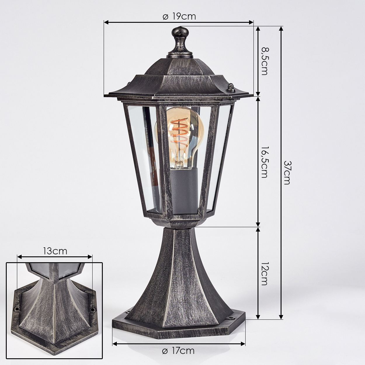 Eine metallische Außenlampe mit Glaseinfassung und Glühbirne. Abmessungen sind beschriftet. Eine kleinere Ansicht zeigt die Basis der Lampe.