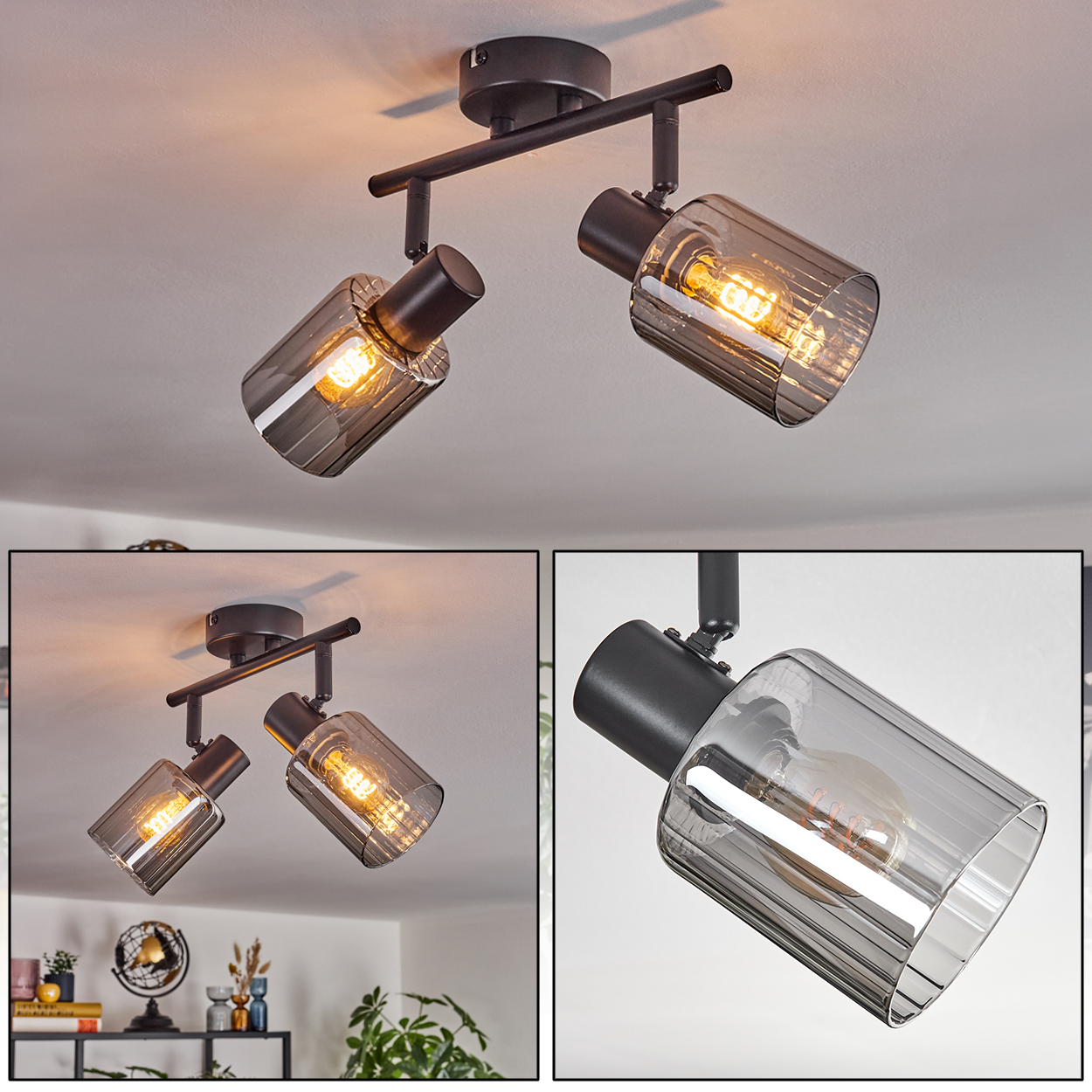 Ein moderner Deckenstrahler mit zwei Lichtern. Jedes Licht hat einen grauen Glasschirm. Die Lichter sind an einem schwarzen Rahmen befestigt.