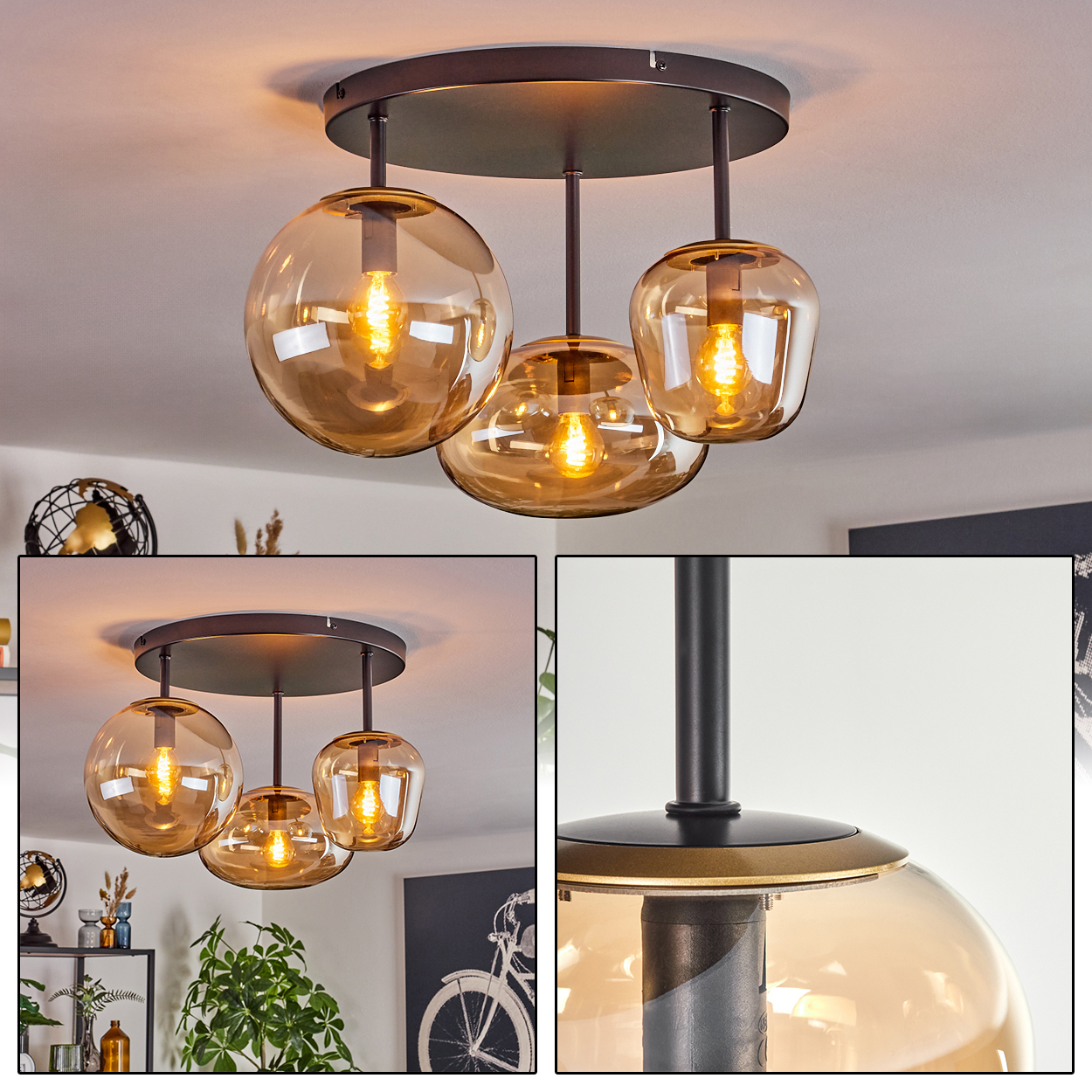 Deckenlampe mit drei bernsteinfarbenen Glasschirmen. Jeder Schirm beherbergt eine brennende Glühbirne. Die Leuchte ist schwarz mit goldenem Akzent.