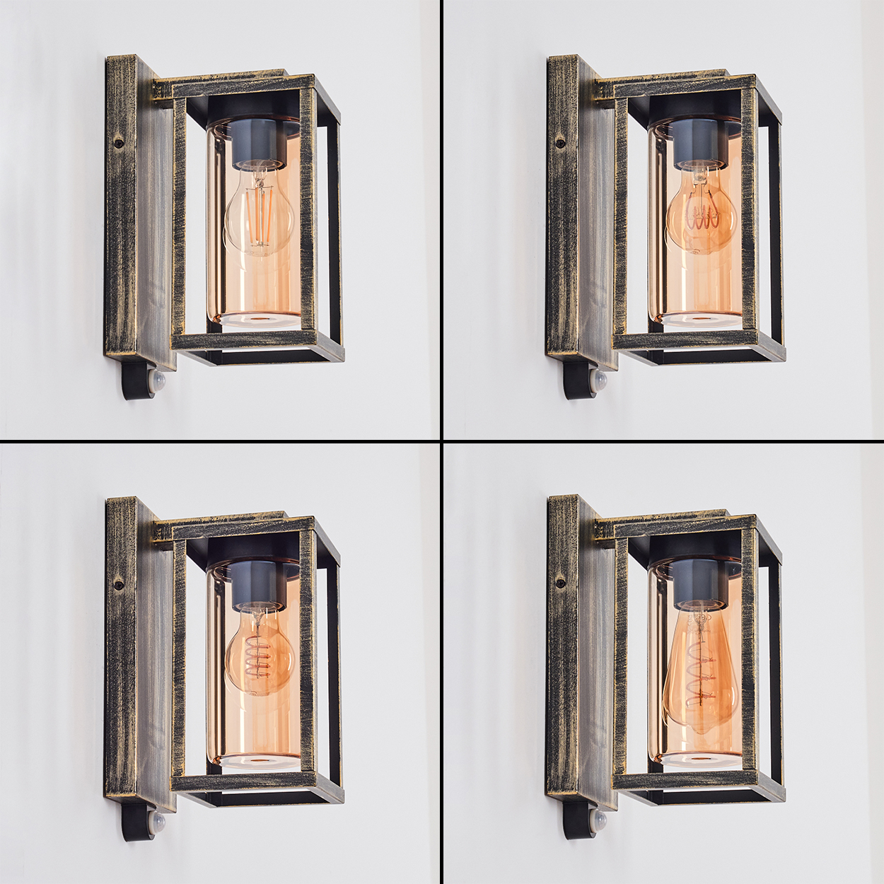 Vier Wandleuchten mit Edison-Glühbirnen an einer weißen Wand. Jede hat einen schwarzen Rahmen, ein Glasgehäuse und einen Bewegungssensor.