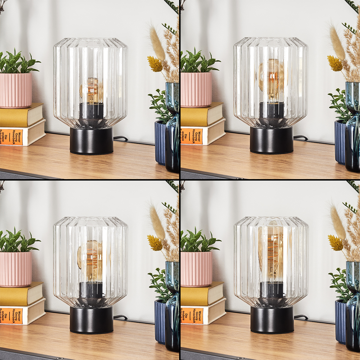 Eine Lampe mit Glasschirm steht auf einer Holzoberfläche. Rosa Topfpflanzen und Bücher sind in der Nähe. Hintergrund umfasst Vasen und einen weißen Vorhang.