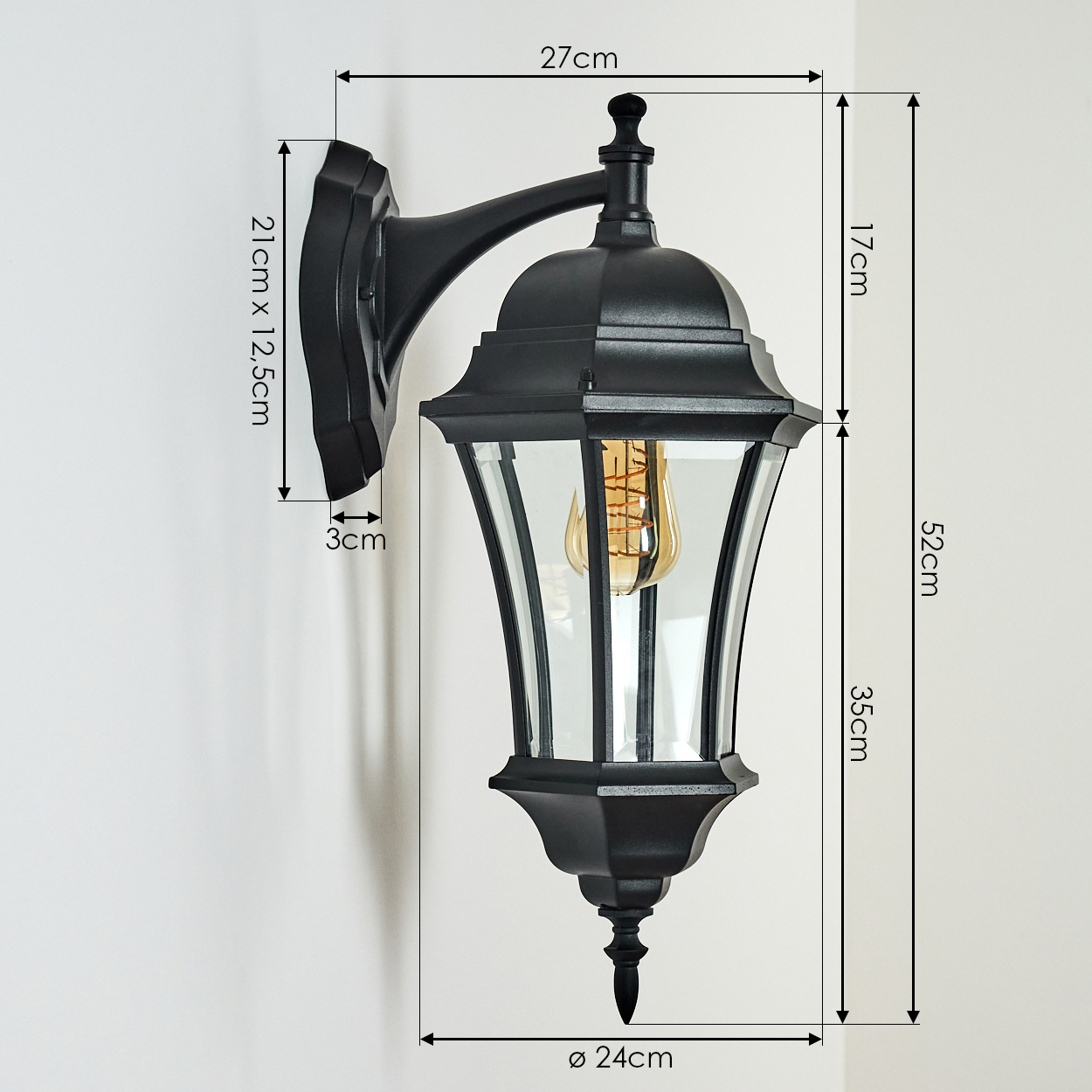 Schwarze Außenlampe mit Glaspaneelen und dekorativem Knauf. Abmessungen sind beschriftet: 27 cm, 52 cm, 35 cm und 24 cm Durchmesser.