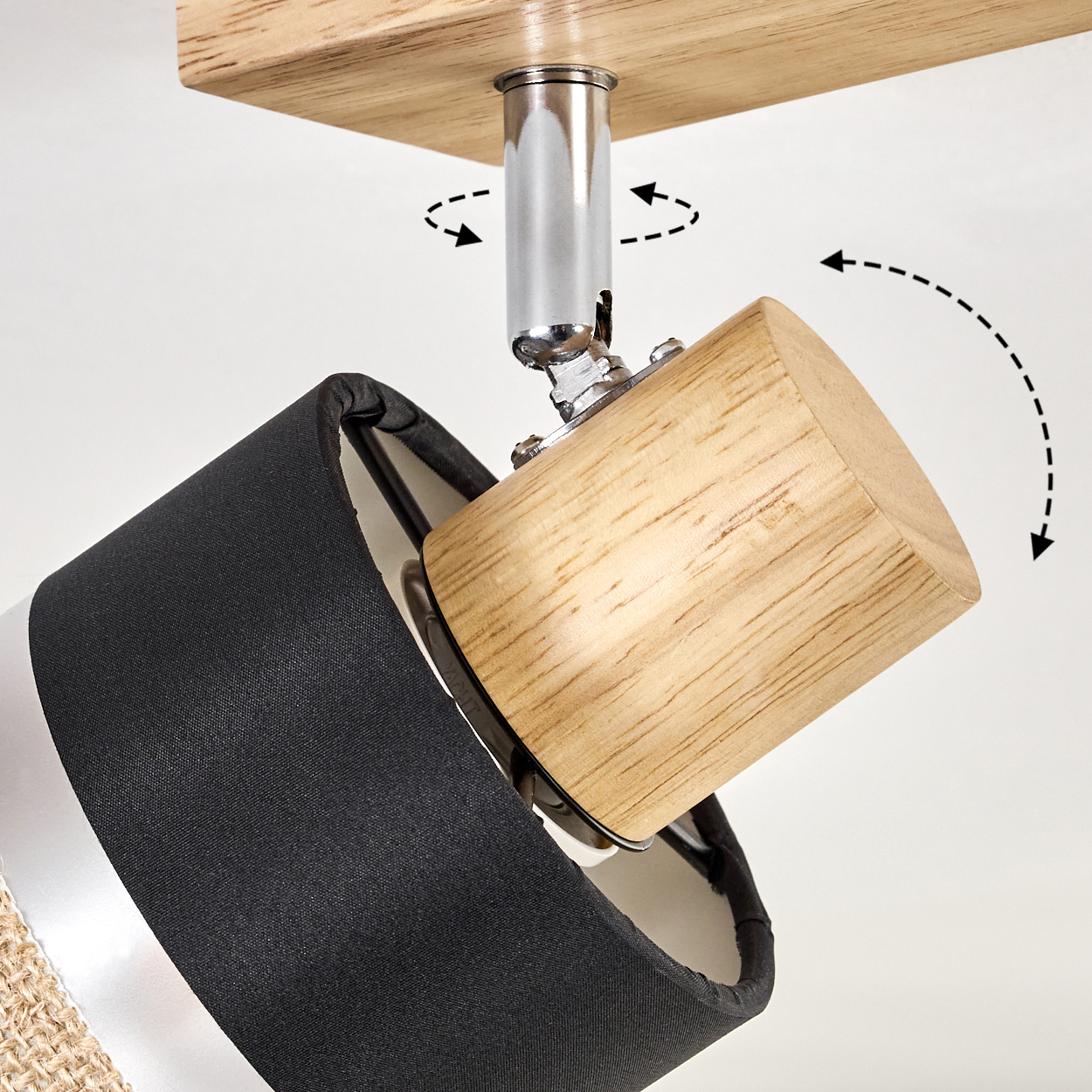 Deckenleuchte mit schwarzem Lampenschirm und Holzfuß. Pfeile zeigen Bewegungsrichtungen an.