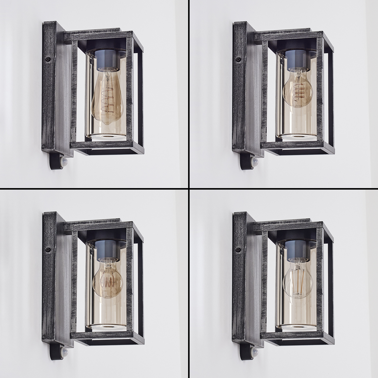 Vier Wandlampen mit rechteckigem Metallrahmen und Glühbirne im Glaszylinder, an einer weißen Wand montiert.
