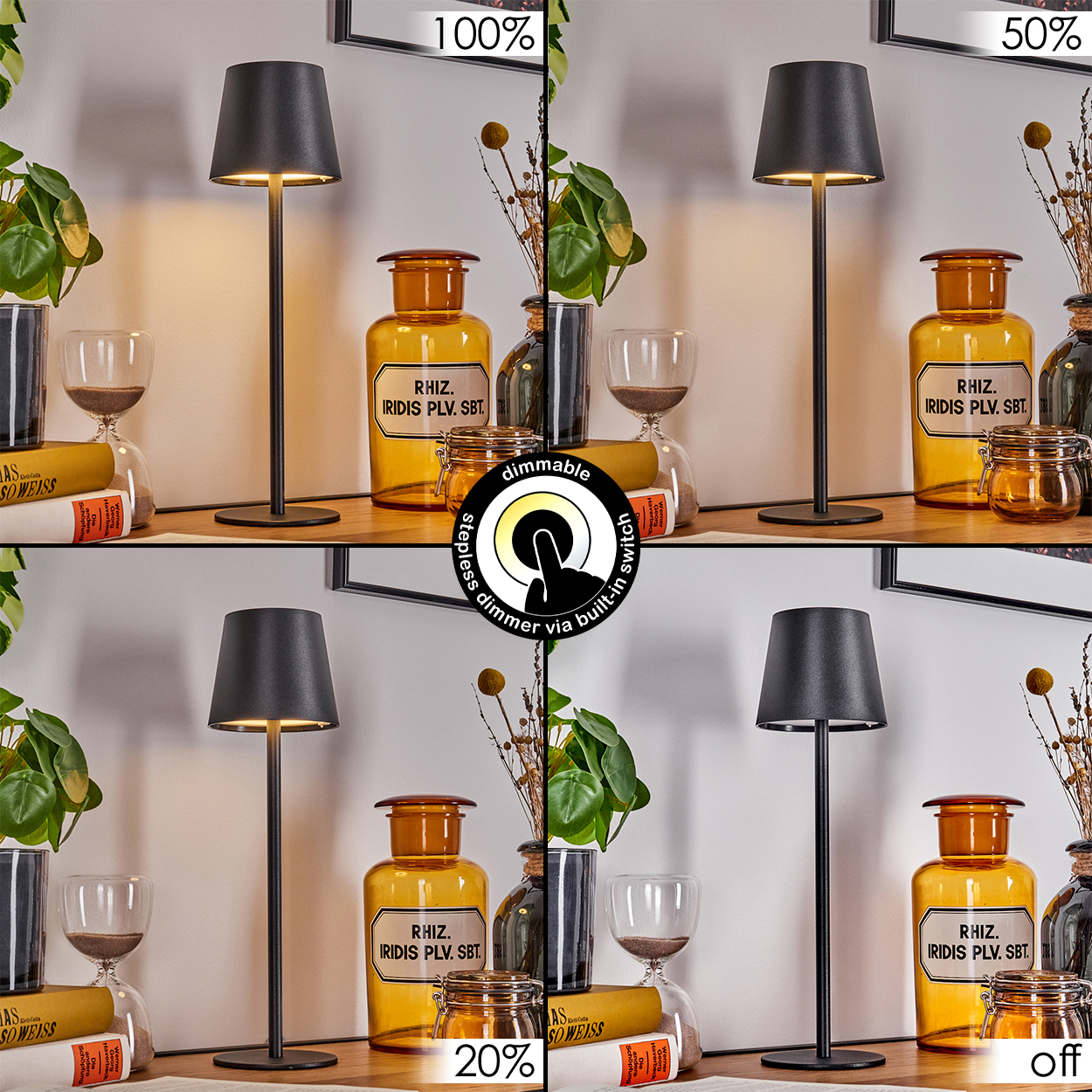 Eine dimmbare schwarze Lampe mit Lampenschirm steht auf einem Holztisch. Weitere Gegenstände sind Gläser, Bücher und Pflanzen.