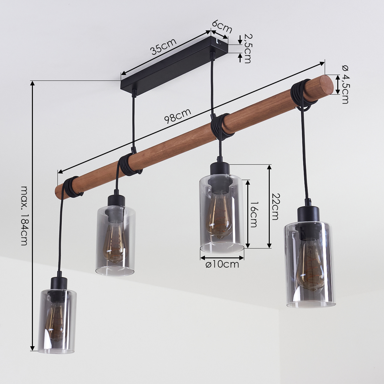 Ein Holzbalken mit drei Hängelampen mit transparenten Glasschirmen und schwarzen Halterungen. Maße sind mit Pfeilen markiert.