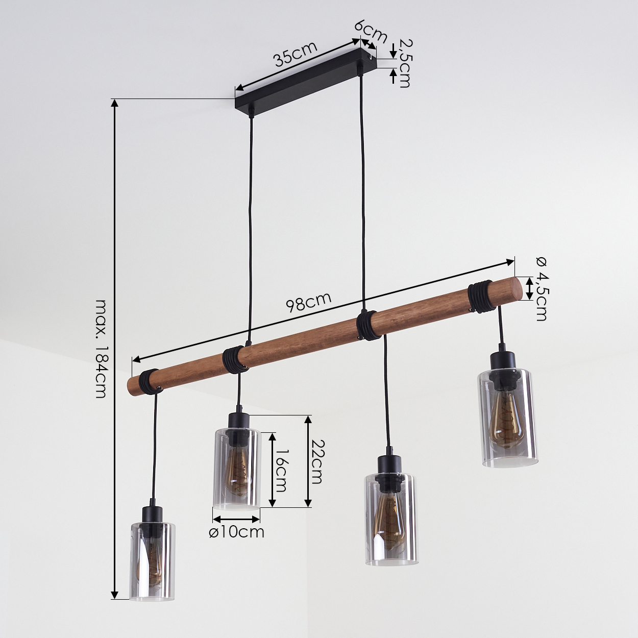 Ein Holzbalken mit vier Pendelleuchten. Abmessungen sind angegeben. Die Leuchten haben transparente Glasschirme und schwarze Armaturen, vor weißem Hintergrund.