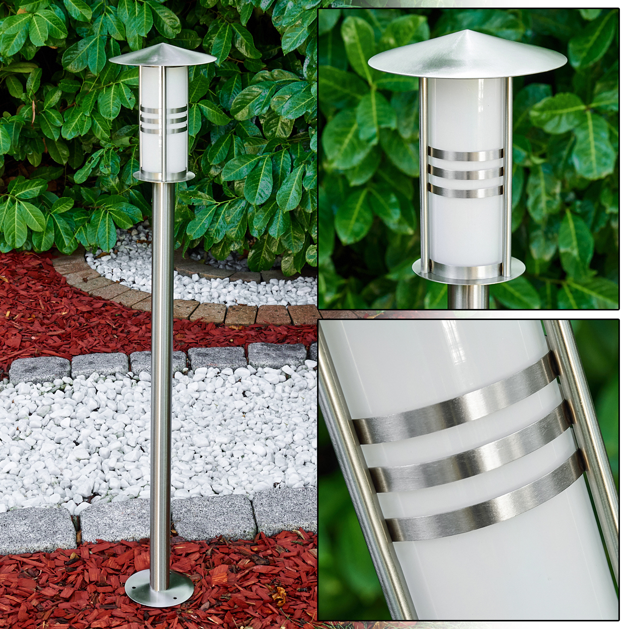 Eine Außenlampe aus Edelstahl. Sie hat einen weißen zylindrischen Körper mit silbernen Bändern und wird von einem kleinen abgewinkelten Dach gekrönt. Sie steht in einem Garten.
