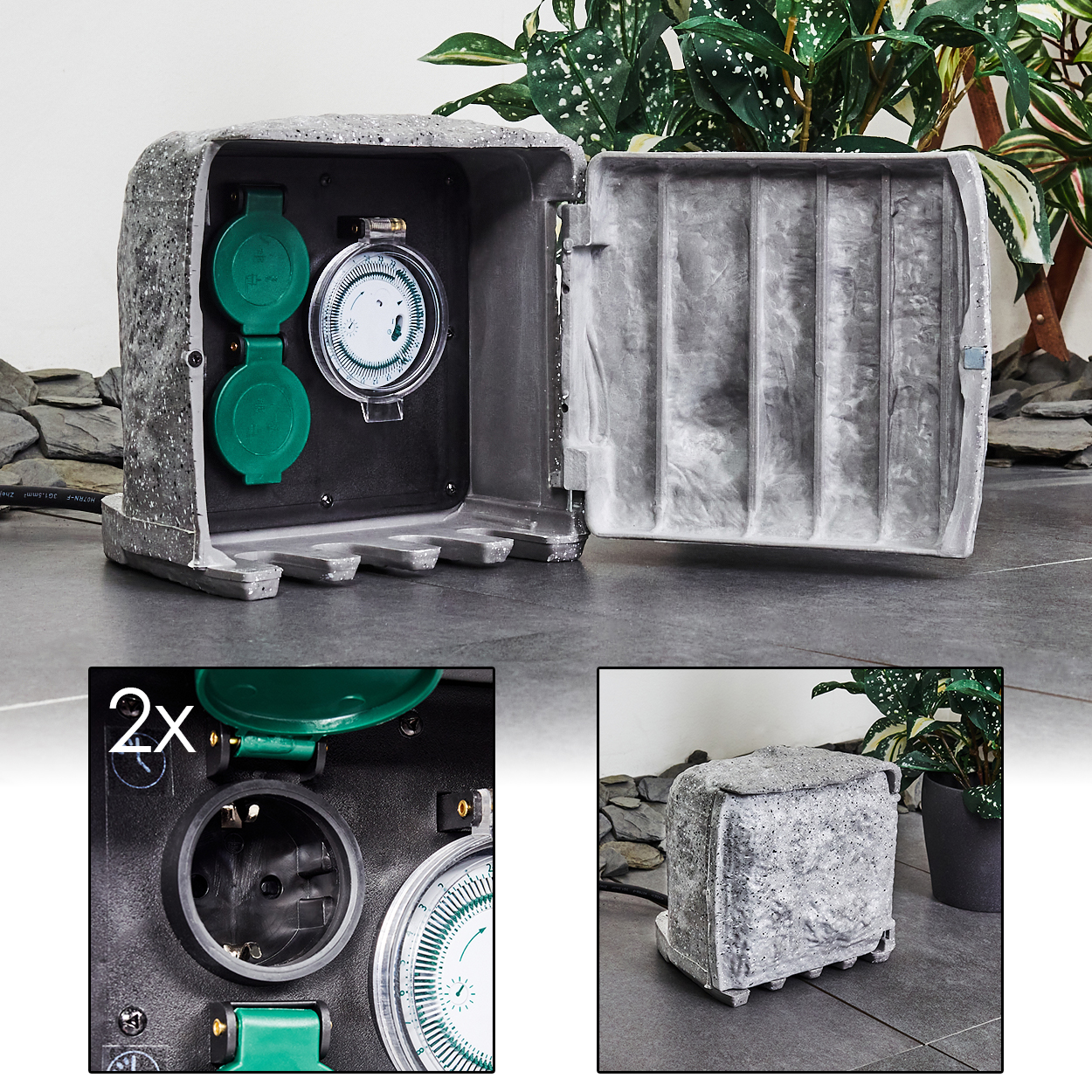 Graue Outdoor-Timer-Box mit grünen Steckdosen und Zifferblatt. Geöffnete Tür zeigt das Innere. Hintergrund mit Pflanzen und Steinboden.