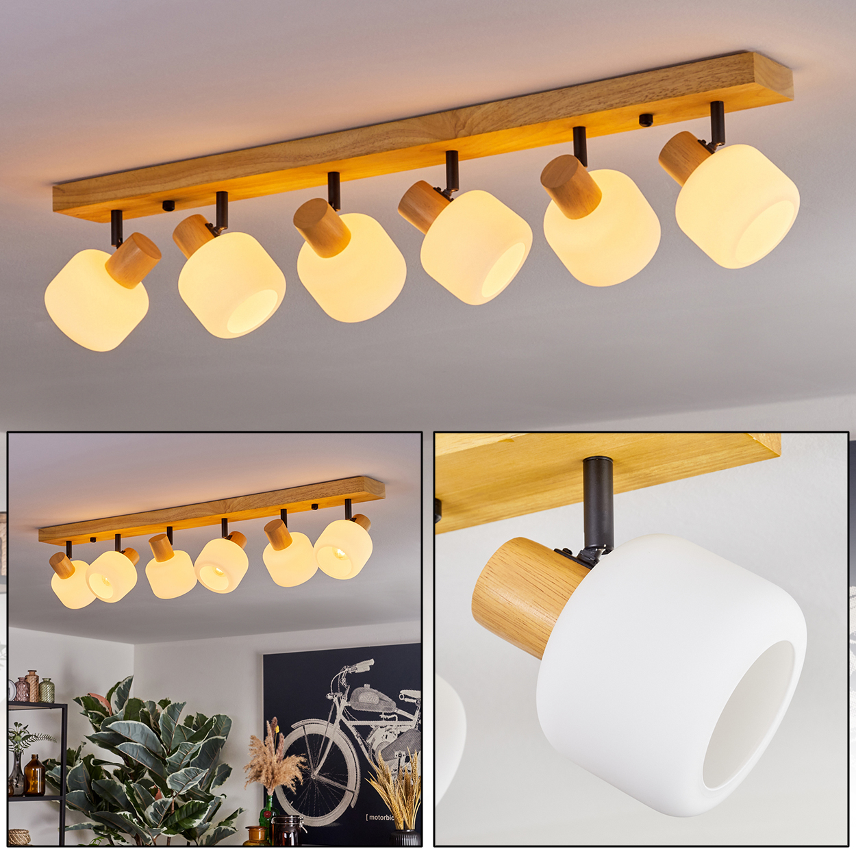 Eine Deckenleuchte mit sieben weißen, abgerundeten Lampen, die an einem Holzbalken befestigt sind. Das Licht ist an und beleuchtet den Raum.