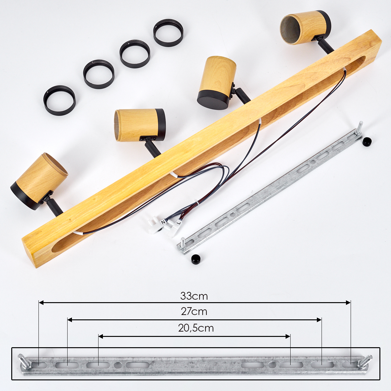 Zerlegte Holzstrahler. Enthält Holzbalken mit Lichtern, Metallhalterung, schwarze Ringe und Verkabelung. Maße sind angegeben.