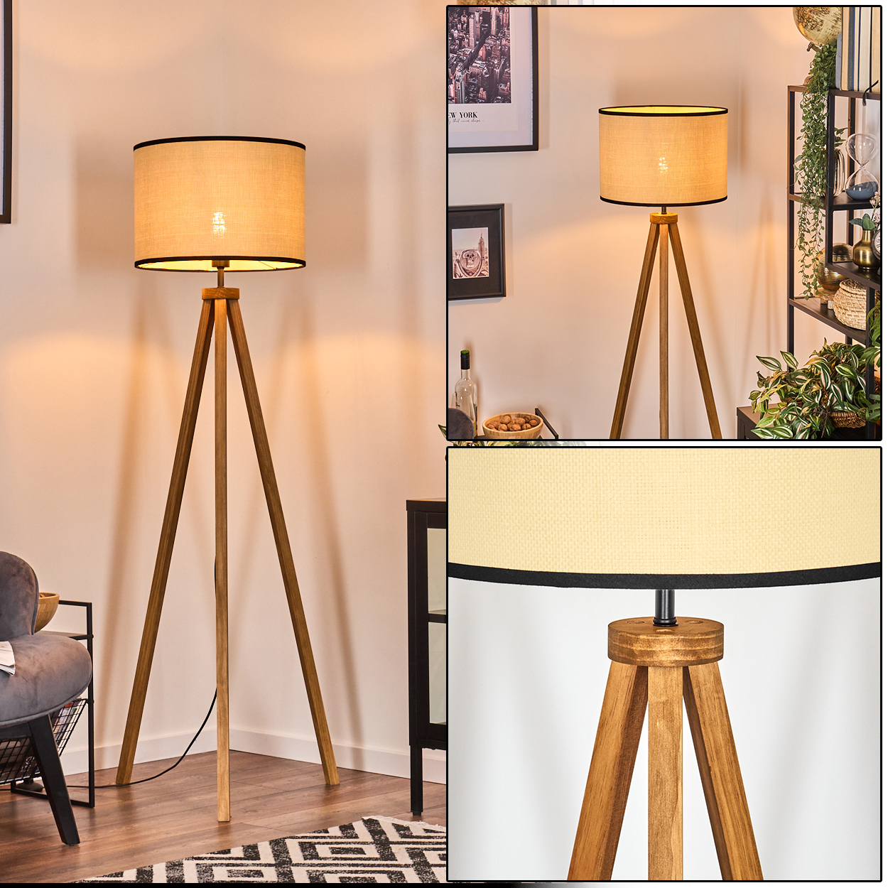 Eine hölzerne Stativ-Stehlampe mit beigem Lampenschirm. Die Lampe steht in einem Raum mit Bildern und einem schwarzen Schrank.