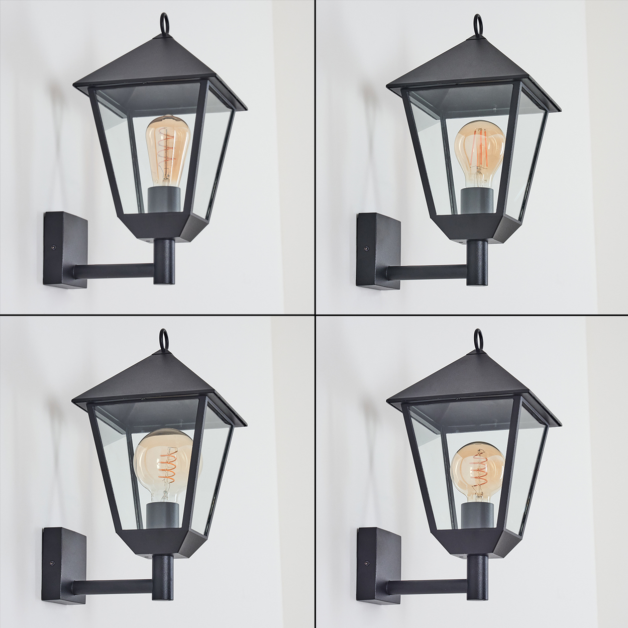 Vier schwarze Wandlampen mit Glasscheiben und sichtbaren Glühbirnen werden vor einer weißen Wand gezeigt.