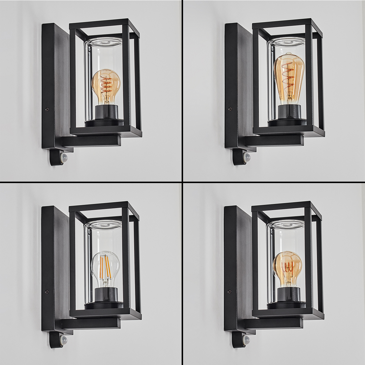 Vier schwarze Wandlampen mit Glasröhren und Glühbirnen an einer weißen Wand. Jede Lampe hat einen anderen Glühbirnenstil.