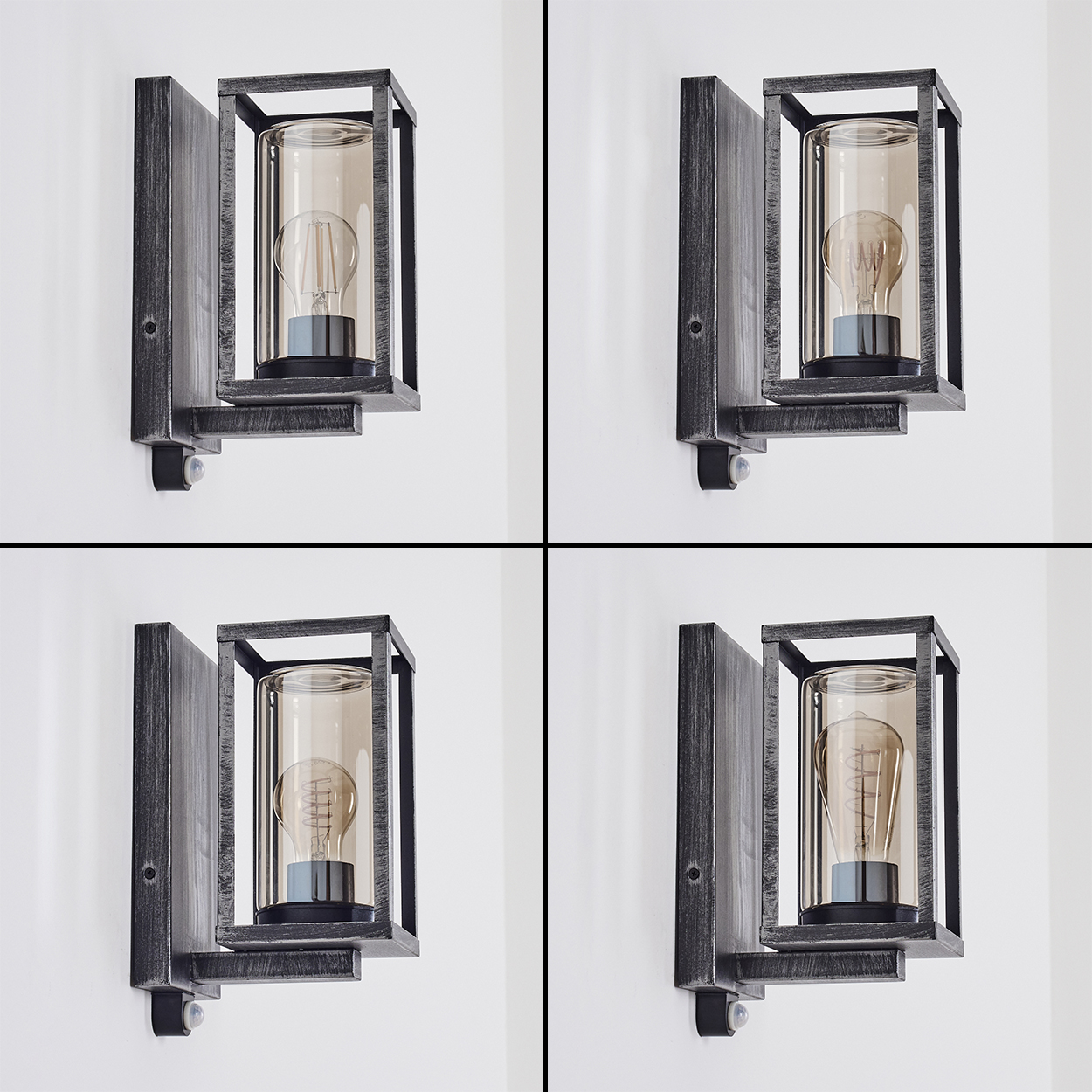 Vier identische Wandlampen. Jede hat einen dunklen Rahmen, einen Glaskolben und eine Glühbirne. Alle sind an einer weißen Wand montiert.