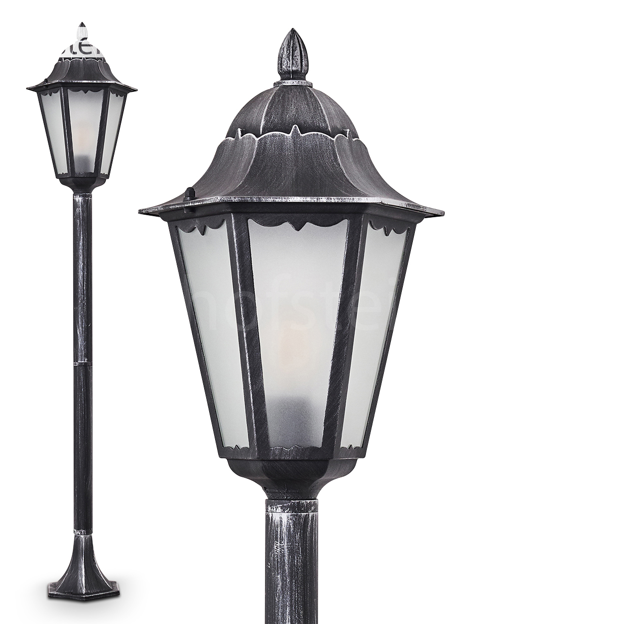 Zwei verzierte Straßenlaternen in Schwarz und Silber vor weißem Hintergrund. Eine Lampe ist näher und zeigt Details.