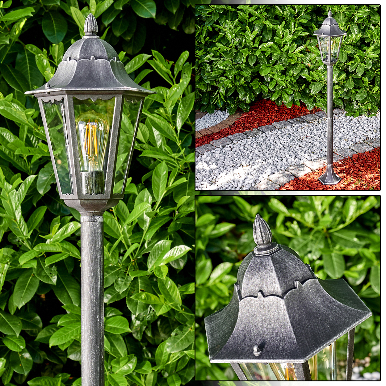 Eine graue Außenlampe steht vor grünem Laub. Roter Mulch und weiße Steine bilden einen Weg in der Nähe der Lampe.