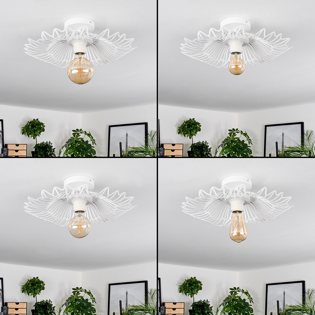 Vier Deckenleuchten mit weißen, flügelförmigen Rahmen und Edison-Glühbirnen. Der Hintergrund zeigt Pflanzen, Bilder und eine weiße Wand.