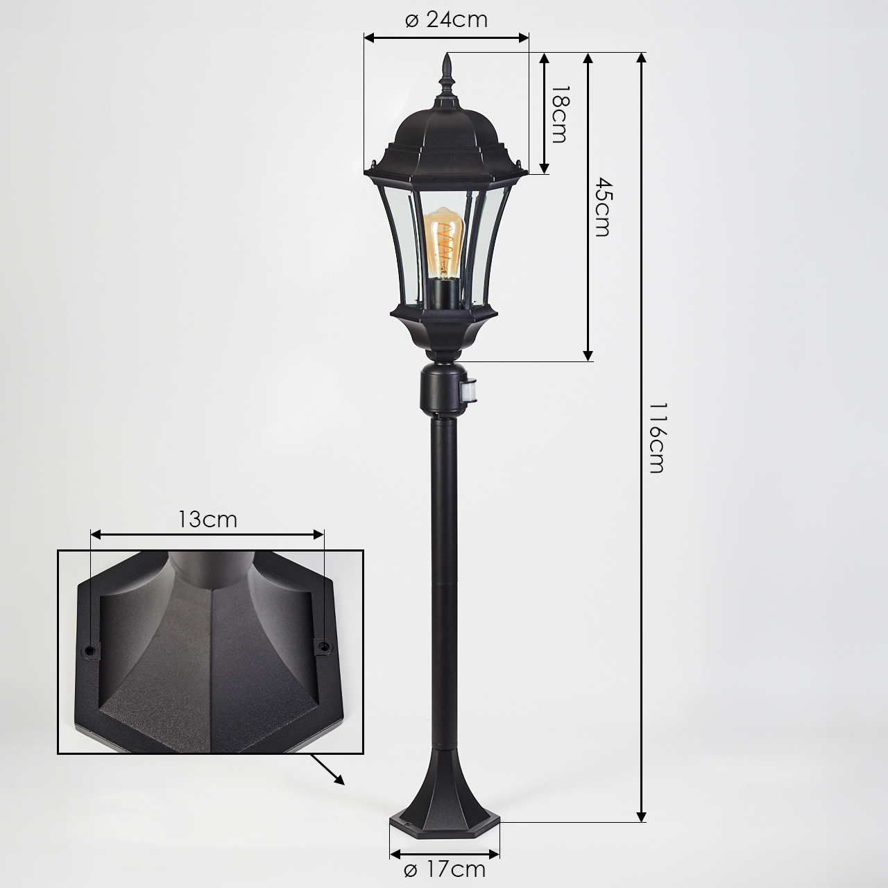 Schwarze Außenlampe mit Maßen. Verfügt über eine Glühbirne, Basisdetail und Gesamthöhenmessung vor weißem Hintergrund.