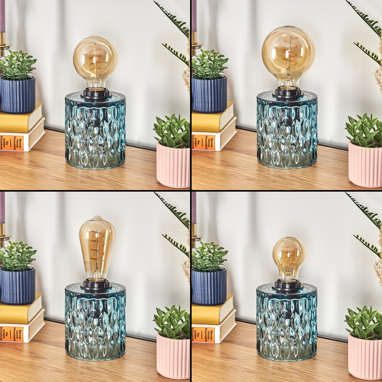 Eine Lampe mit einer Vintage-Glühbirne steht auf einer Holzoberfläche. Kleine Topfpflanzen und Bücher befinden sich in der Nähe, mit weißem Vorhanghintergrund.