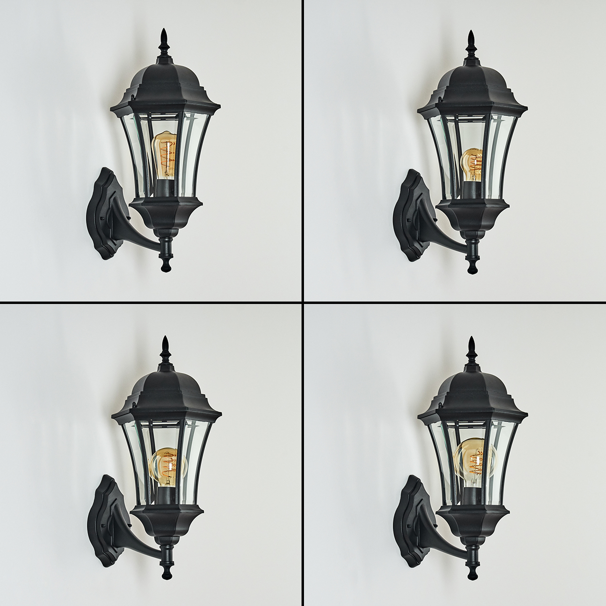 Vier schwarze Wandlampen mit Glasplatten und beleuchteten Glühbirnen sind an einer weißen Wand in einem 2x2-Raster angeordnet.
