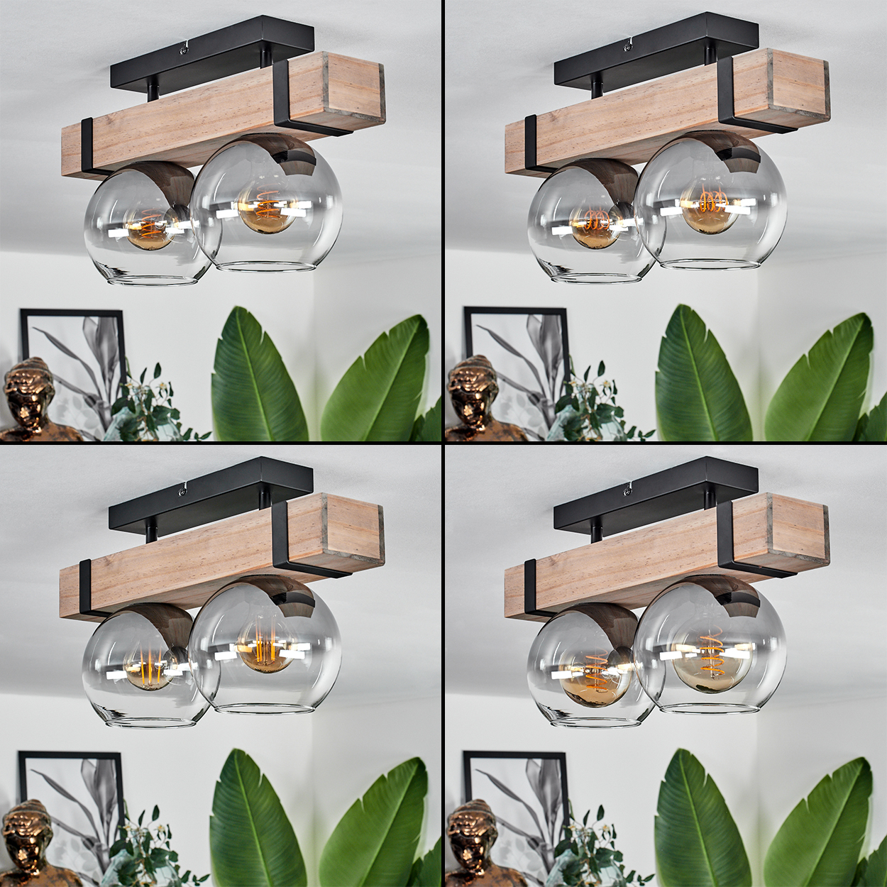 Eine Deckenlampe mit zwei Glaskugeln, Holz und schwarzem Metall. Im Hintergrund sind grüne Blätter und Kunst an der Wand zu sehen.
