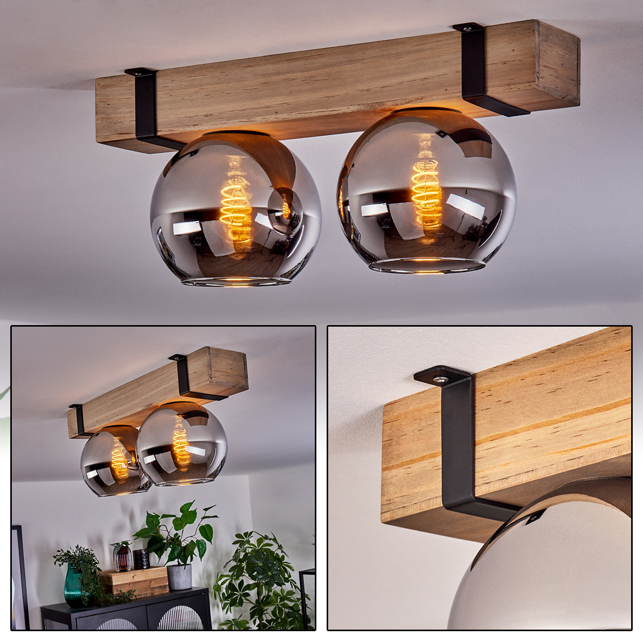 Deckenleuchte mit zwei Glaskugeln und freiliegenden Glühbirnen, die an einem Holzbalken hängen, befestigt mit schwarzen Metallwinkeln.