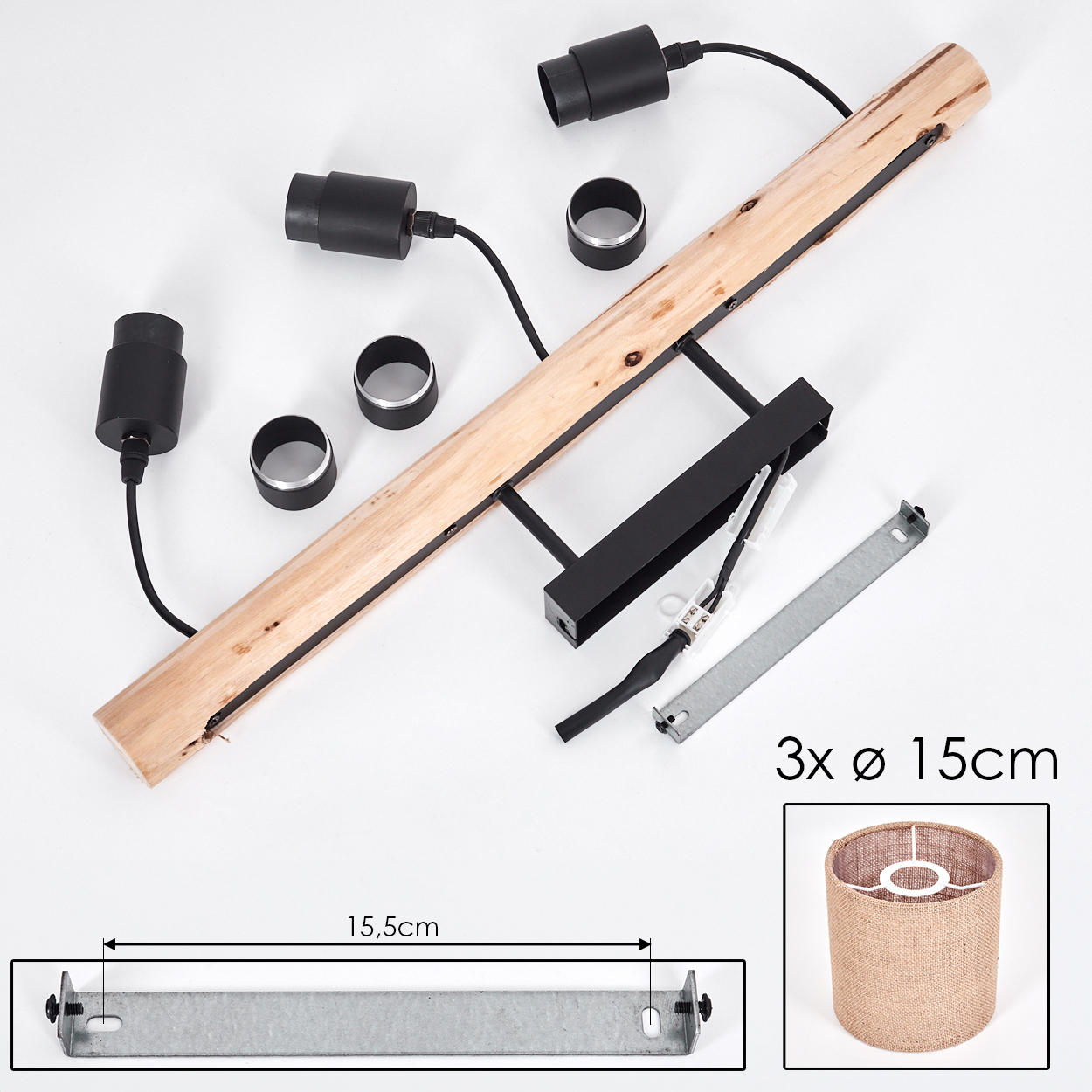 Komponenten einer Lampe auf weißem Untergrund. Enthält Holzbalken, schwarze Lampenfassungen, Metallringe und einen Lampenschirm.