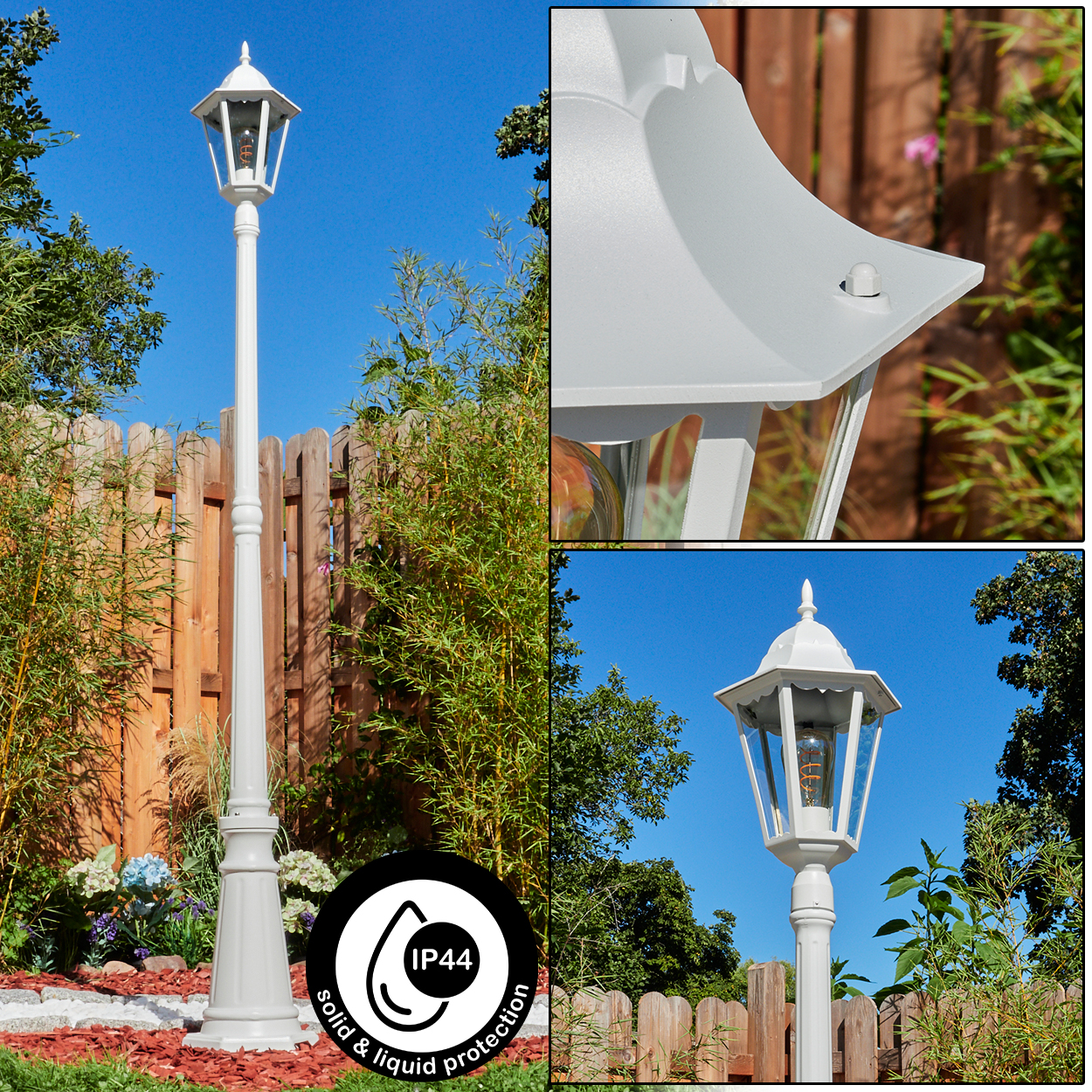 Eine weiße Außenlaterne in einem Garten. Die Lampe ist hoch, mit detaillierter Spitze. Der Hintergrund umfasst Bäume, einen Zaun und blauen Himmel.