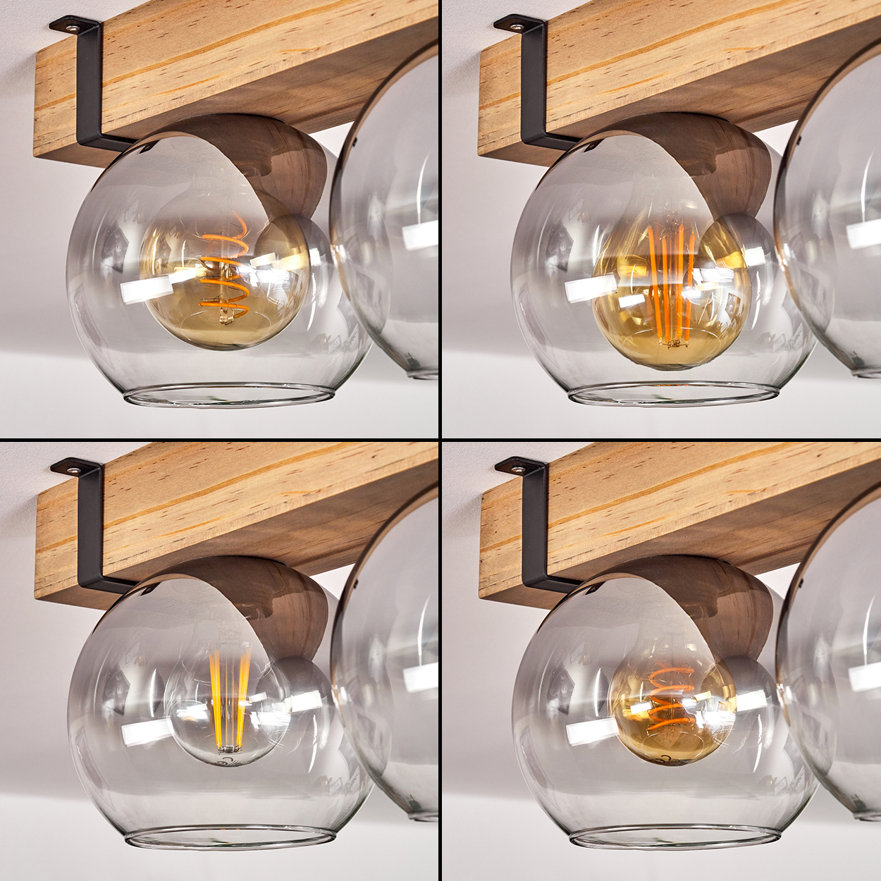 Eine moderne Leuchte mit transparenten Kugelschirmen. Jede enthält eine brennende Glühbirne. Montiert an einem Holzbalken.
