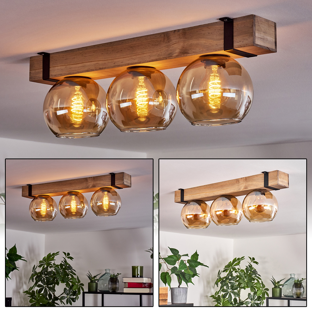 Eine Deckenleuchte aus Holzbalken mit drei bernsteinfarbenen Glaskugeln. Die Glühbirnen darin sind beleuchtet. Das Licht ist an einer weißen Decke montiert.