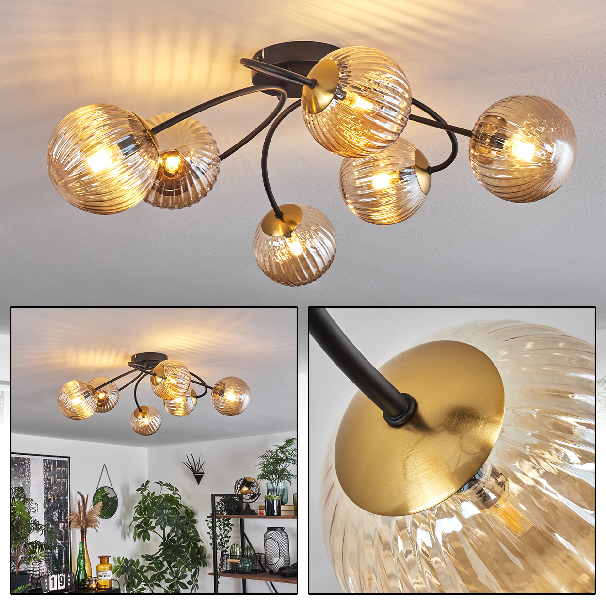Deckenlampe mit sechs bernsteinfarbenen Glaskugeln. Schwarze Arme erstrecken sich von einem zentralen Sockel. Die Leuchten sind eingeschaltet und beleuchten den Raum.