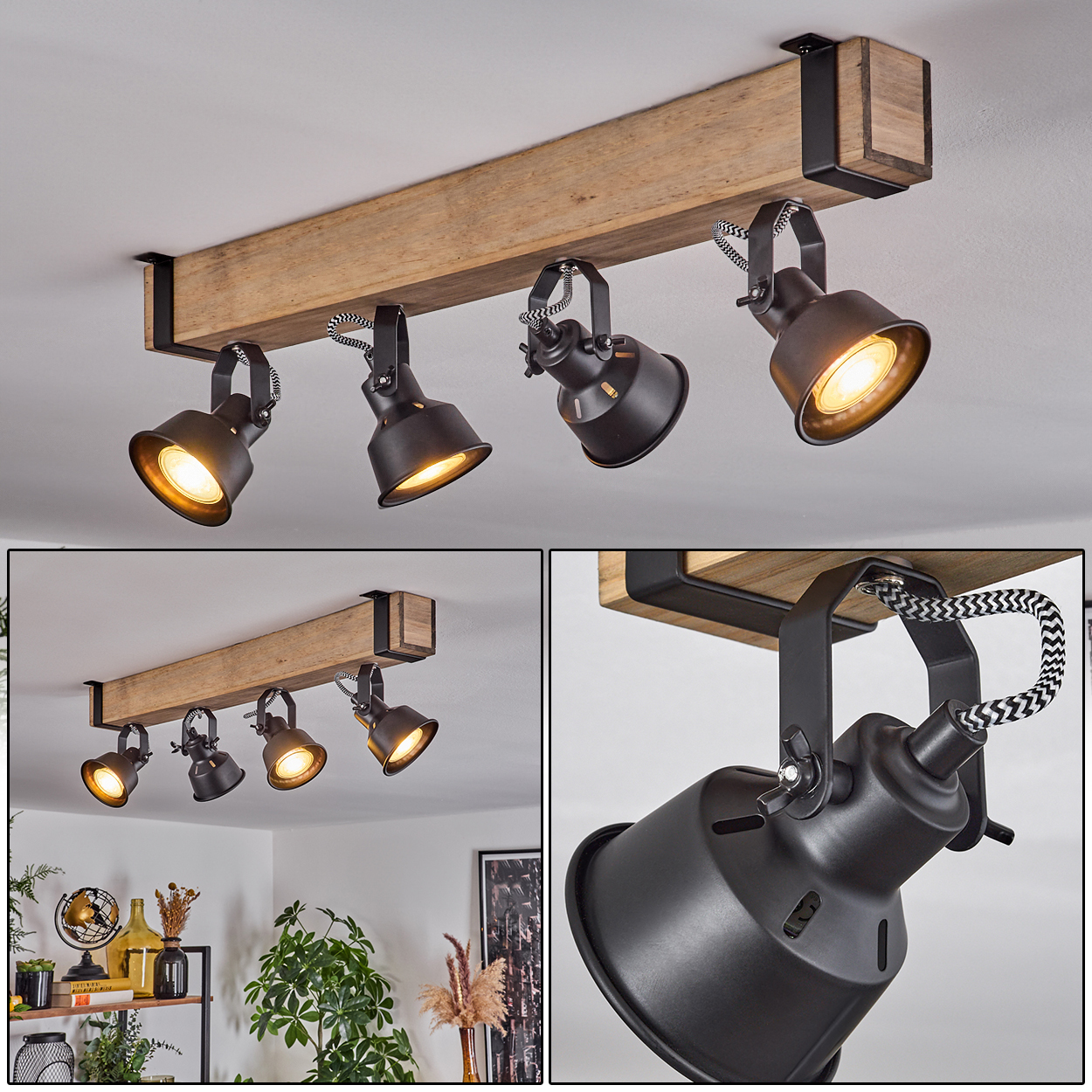 Deckenleuchte mit vier schwarzen Strahlern an einem Holzbalken. Die Lichter sind an und beleuchten den Raum.
