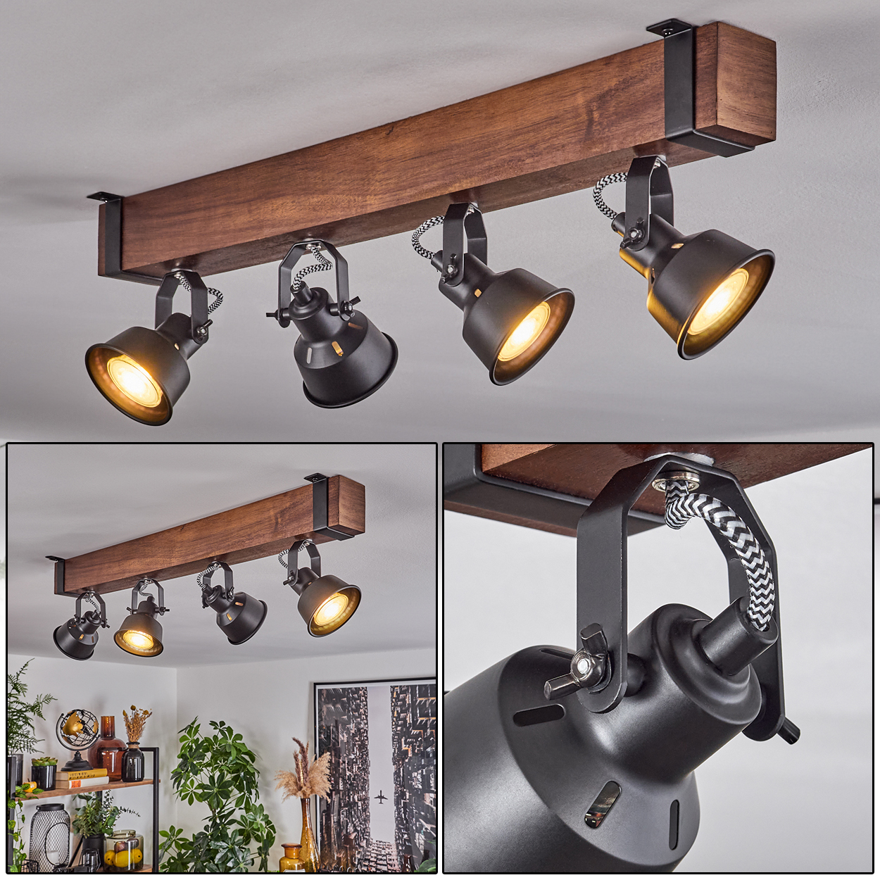Deckenleuchte mit Holzbalken und schwarzen Strahlern. Die Lampen sind nach unten gerichtet und leuchten.