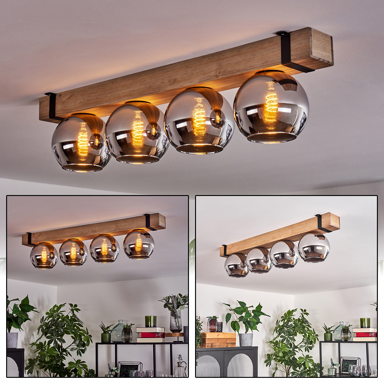 Deckenlampe mit vier Glaskugeln. Sie hat einen Holzbalken und die Glühbirnen leuchten. Im Hintergrund befinden sich Pflanzen und Regale.