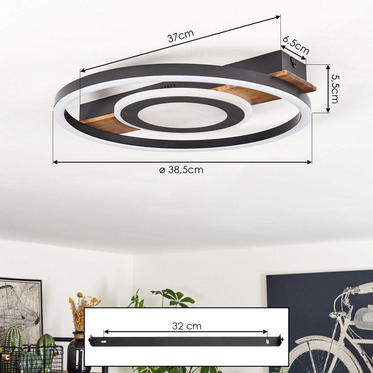 Eine Deckenleuchte mit einem schwarz-weißen kreisförmigen Design. Sie hat Holzakzente und Messungen. Auch eine kleinere schwarze Stange.