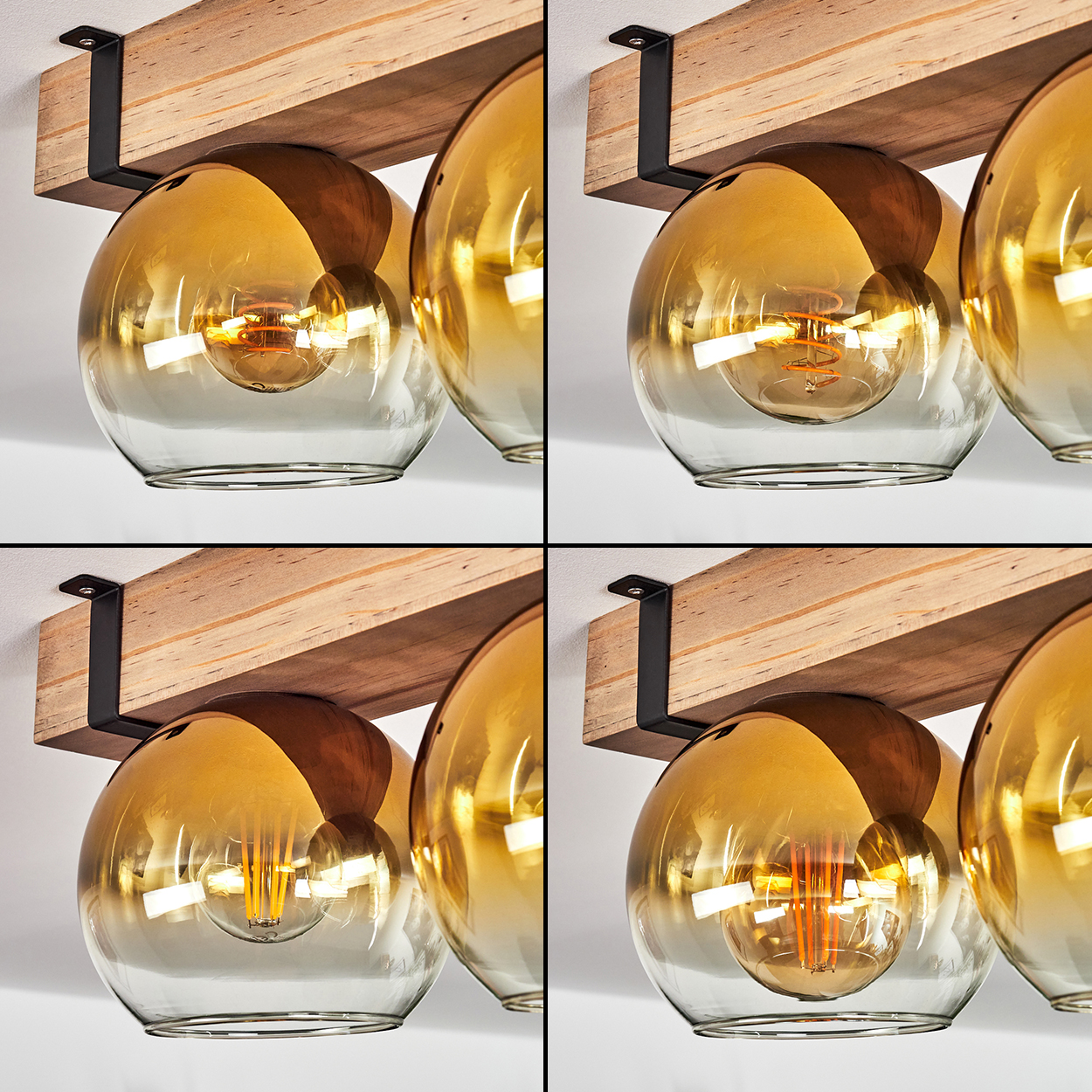 Vier Deckenleuchten mit Glaskugeln. Die Kugeln sind bernsteinfarben und klar. Sie hängen an Holzbalken mit schwarzen Metallhaltern.