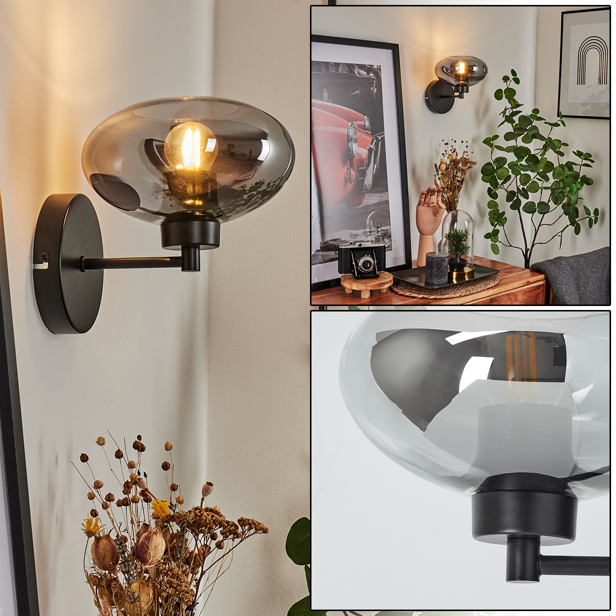 Eine schwarze Wandlampe mit Rauchglasschirm leuchtet. Sie ist an einer weißen Wand befestigt. Es gibt andere Objekte, wie ein Bild und eine Pflanze.