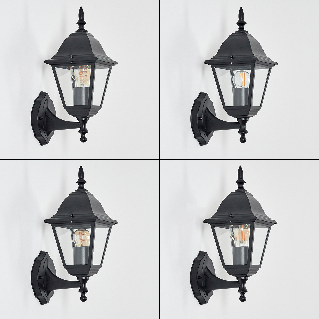 Vier identische schwarze Wandlampen mit transparenten Glasscheiben und Glühbirnen vor weißem Hintergrund.