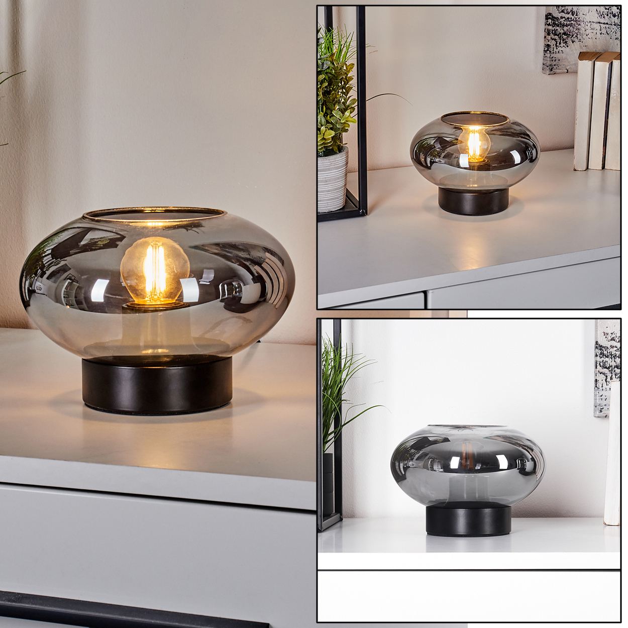 Eine moderne Lampe mit rundem, rauchfarbenem Glasschirm und schwarzem Sockel, beleuchtet von einer warmen Glühbirne. Sie steht auf einer weißen Oberfläche.