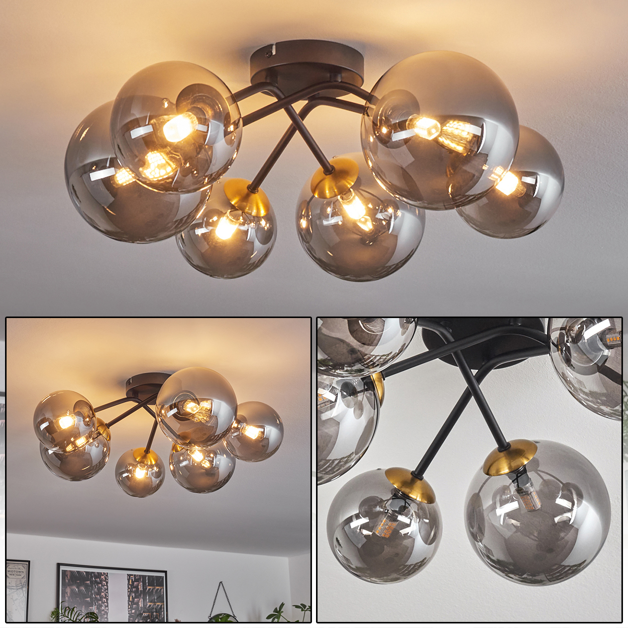 Eine Deckenlampe mit acht grauen Glaskugeln. Die Lampe hat schwarze Arme und goldene Akzente, mit beleuchteten Glühbirnen.