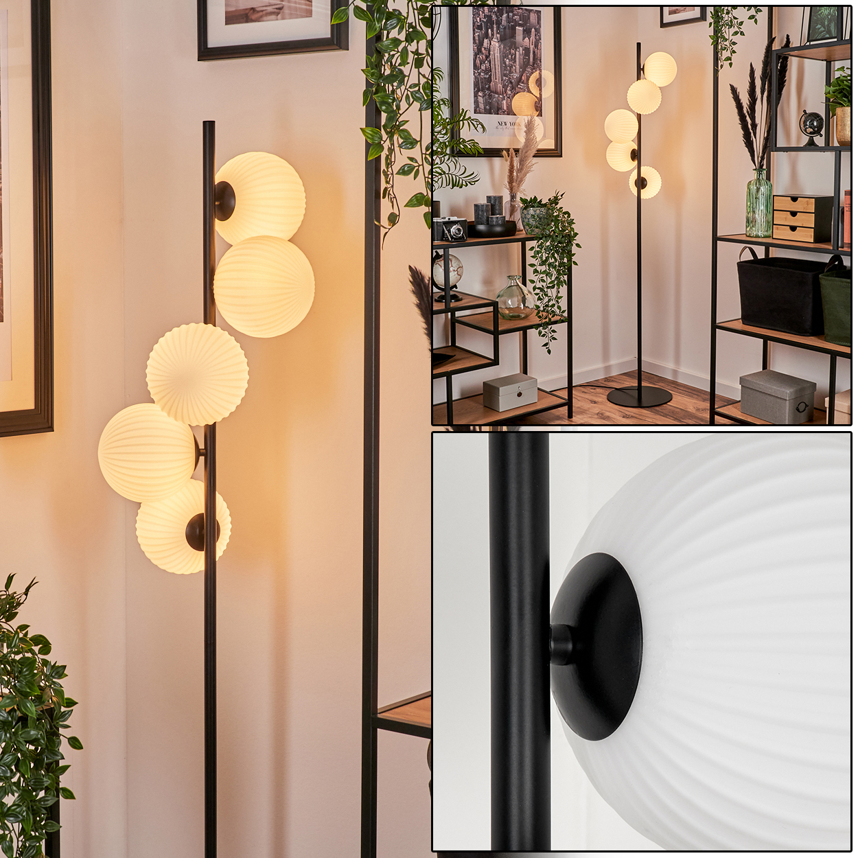 Stehlampe mit weißen Kugelschirmen. Sie steht in einem Raum mit Regalen, Pflanzen und gerahmten Bildern. Die Lampe hat einen schwarzen Rahmen.