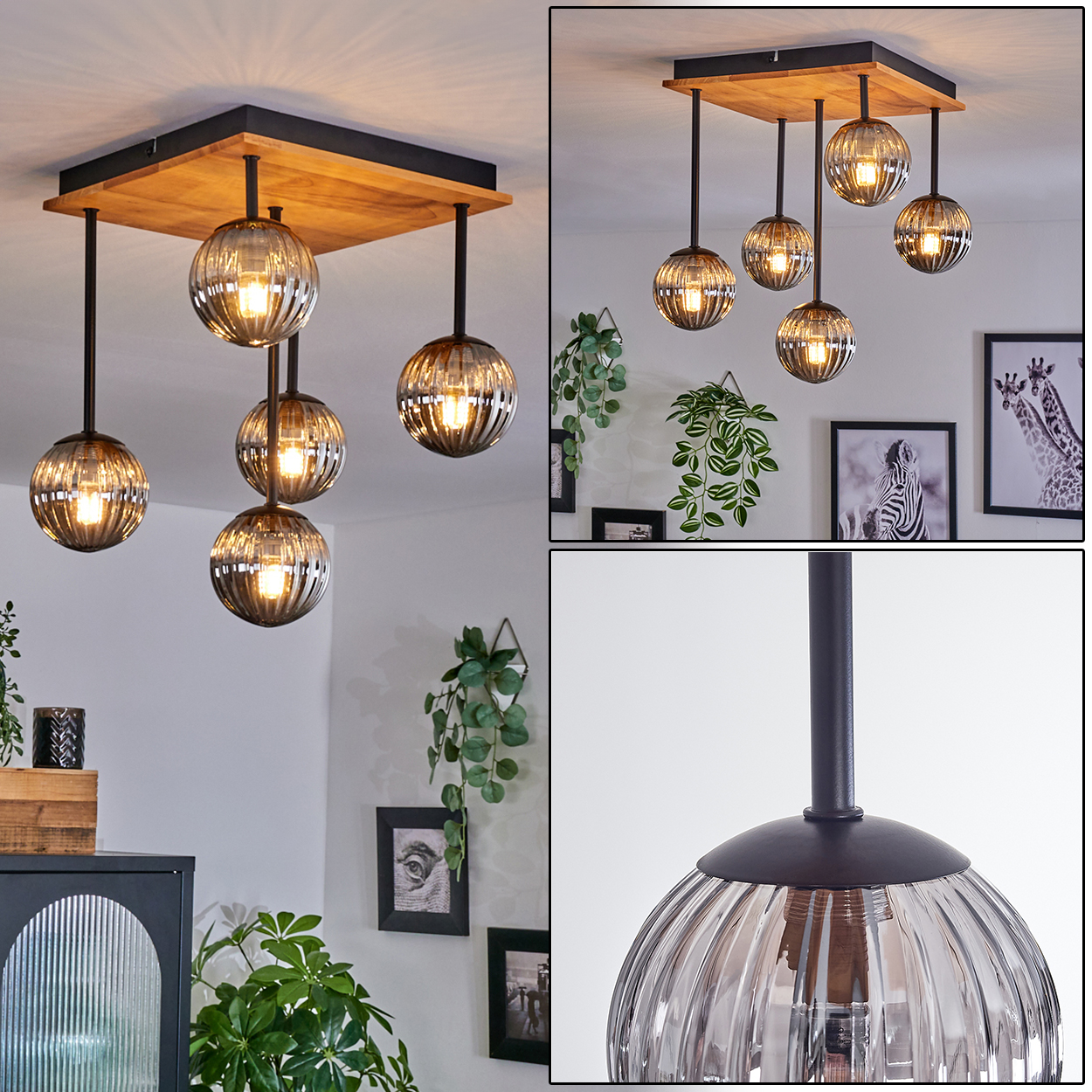 Eine moderne Hängelampe mit Glaskugelschirmen hängt an einem Holzquadrat. Pflanzen und gerahmte Bilder schmücken die Wand.