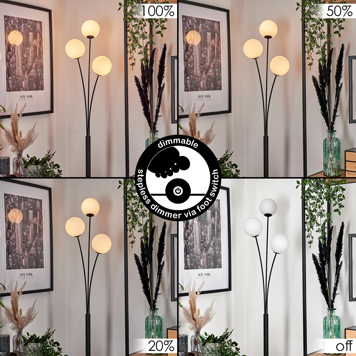 Eine Stehlampe mit drei runden, weißen Glühbirnen. Die Lampe ist schwarz, mit einem Dimmschalter. Dahinter sind gerahmte Bilder und Zierpflanzen zu sehen.