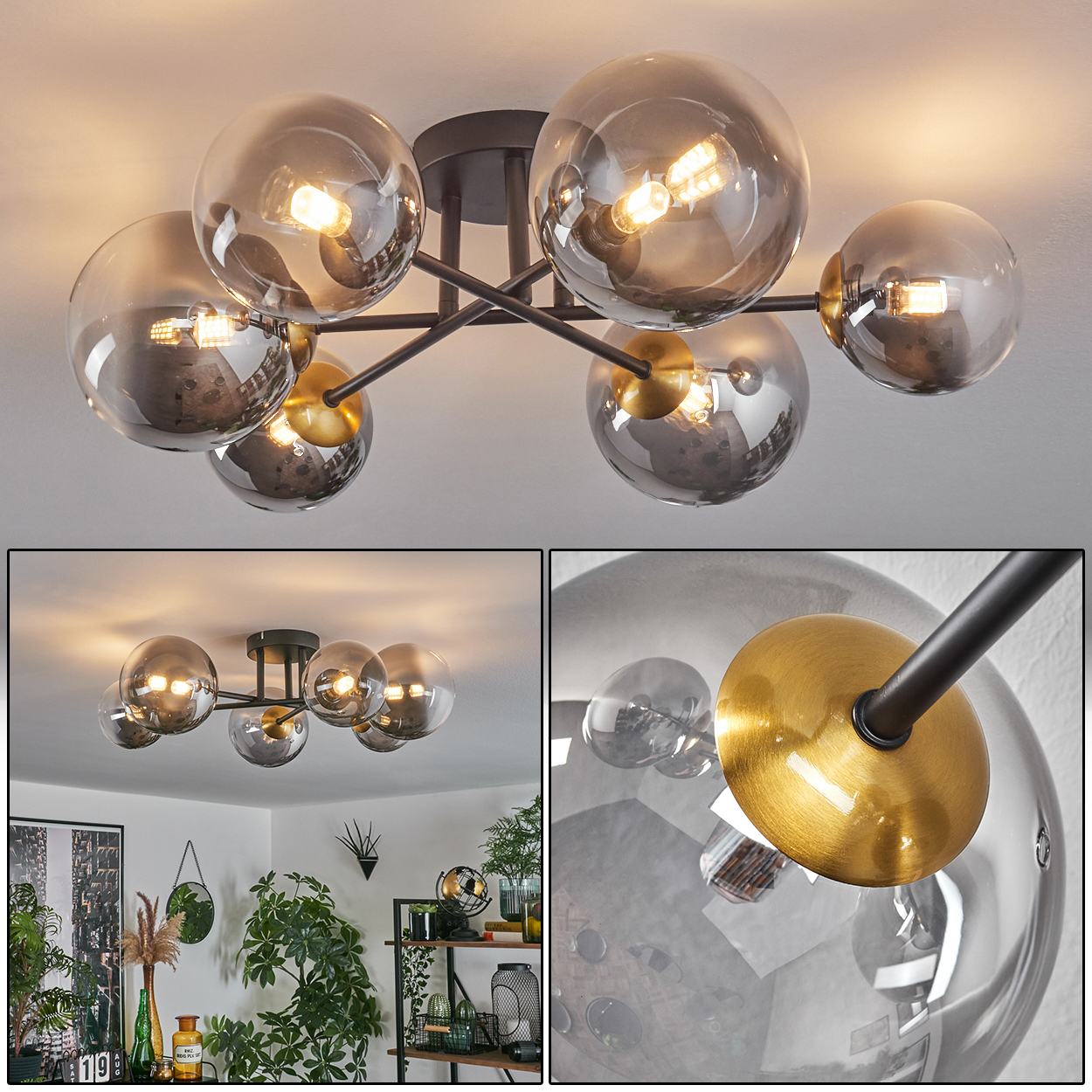Eine moderne Deckenleuchte mit Glaskugeln. Die Leuchte hat einen schwarzen Rahmen und goldene Akzente. Die Kugeln sind grau und reflektieren Licht.