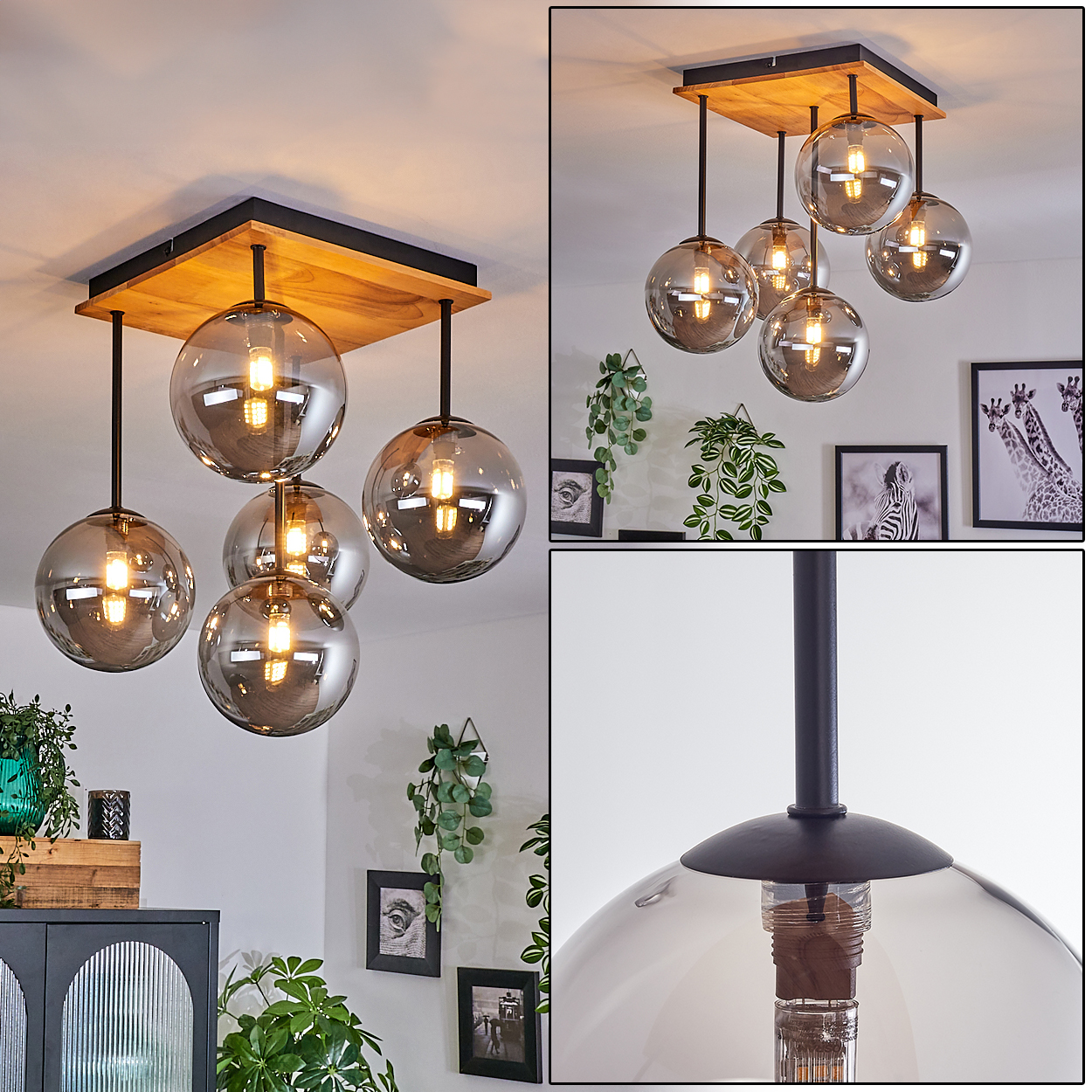 Moderne Deckenlampe mit sechs Rauchglas-Kugeln. Holzsockel, schwarze Stäbe und warm getönte Glühbirnen. Pflanzen, Bilder und Möbel im Hintergrund.