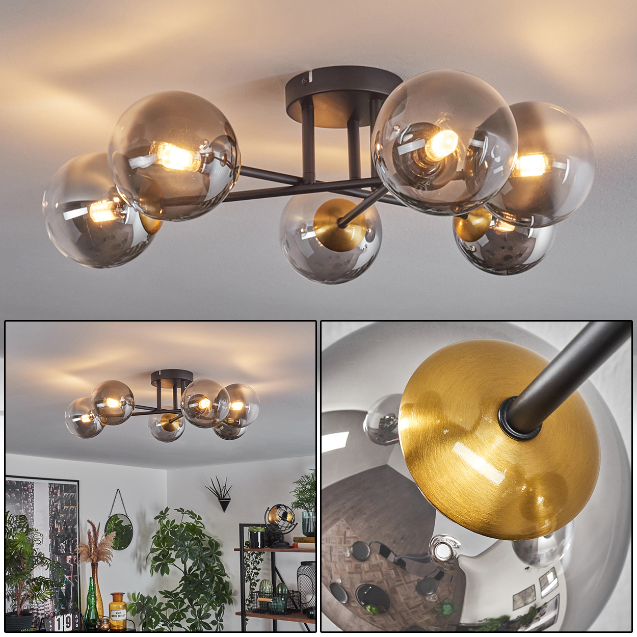 Eine Deckenleuchte mit sechs rauchigen Glaskugeln, jede mit warmem Licht. Die Leuchte ist aus dunklem Metall. Im Hintergrund ein Wohnzimmer.