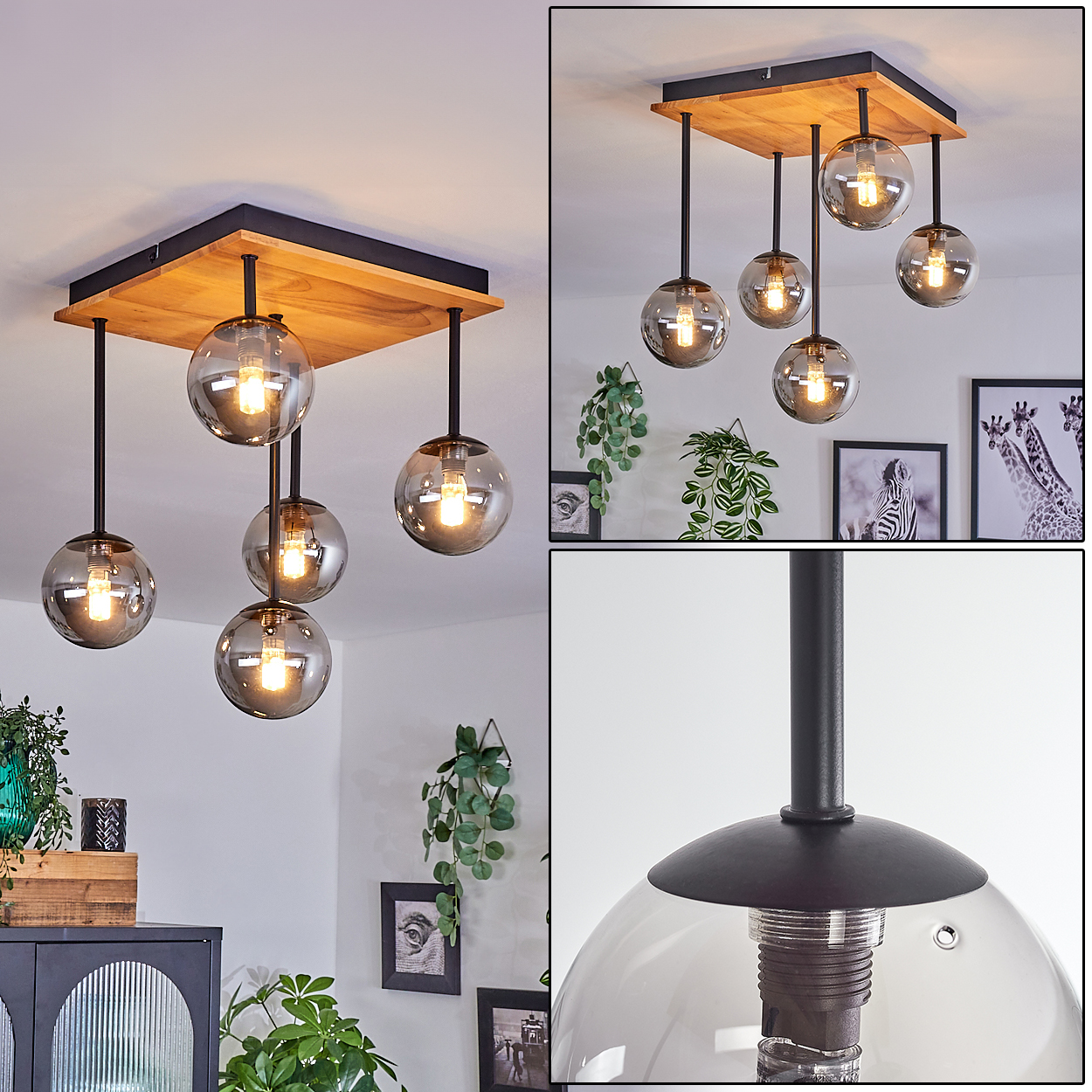 Eine moderne Deckenlampe mit Holzsockel, schwarzen Stäben und Glaskugelschirmen. Es befindet sich in einem Raum mit gerahmten Bildern und Pflanzen.