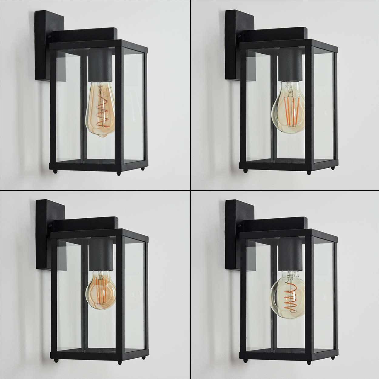 Vier schwarze Außenlampen mit Glas und Glühbirnen. Jede hat einen anderen Glühbirnenstil, der Hintergrund ist eine weiße Wand.